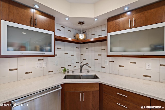 kitchen with dishwasher, a sink, decorative backsplash, glass insert cabinets, and recessed lighting
