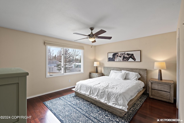 bedroom featuring wood finished floors, baseboards, and a ceiling fan