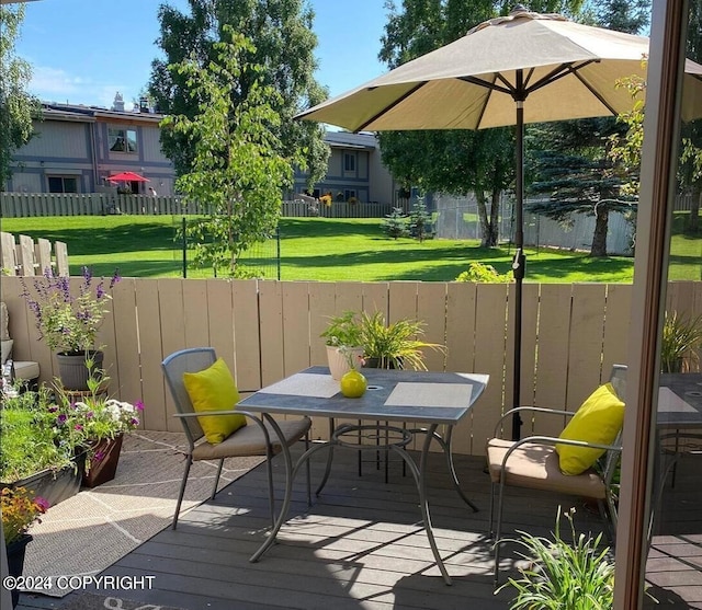 wooden deck with outdoor dining space