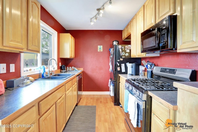 2816 Leighton St, Anchorage, AK 99517 - kitchen featuring stainless steel appliances, light brown cabinetry, light wood finished floors, and rail lighting