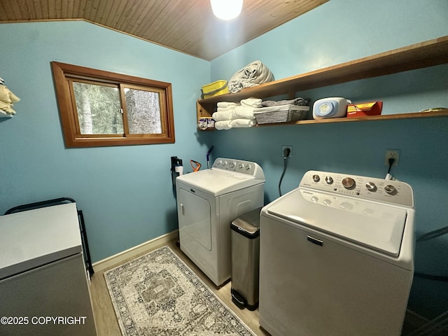 1581 Jade Dr, Homer, AK 99603 - laundry area featuring washing machine and dryer, light wood-style flooring, wood ceiling, and baseboards