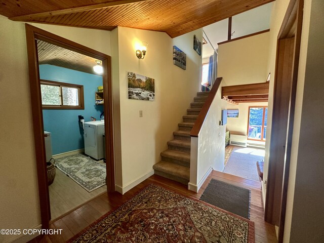 1581 Jade Dr, Homer, AK 99603 - stairs with wood ceiling, lofted ceiling, washing machine and dryer, wood finished floors, and baseboards