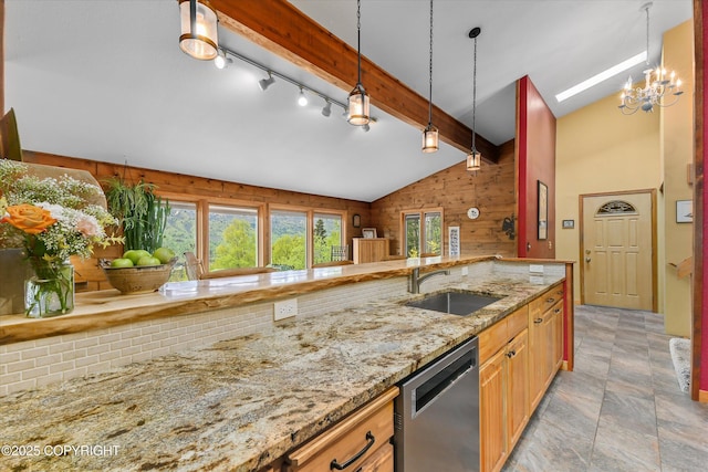 26266 Vallihi Cir, Eagle River, AK 99577 - kitchen with a sink, dishwasher, rail lighting, decorative light fixtures, and wood walls