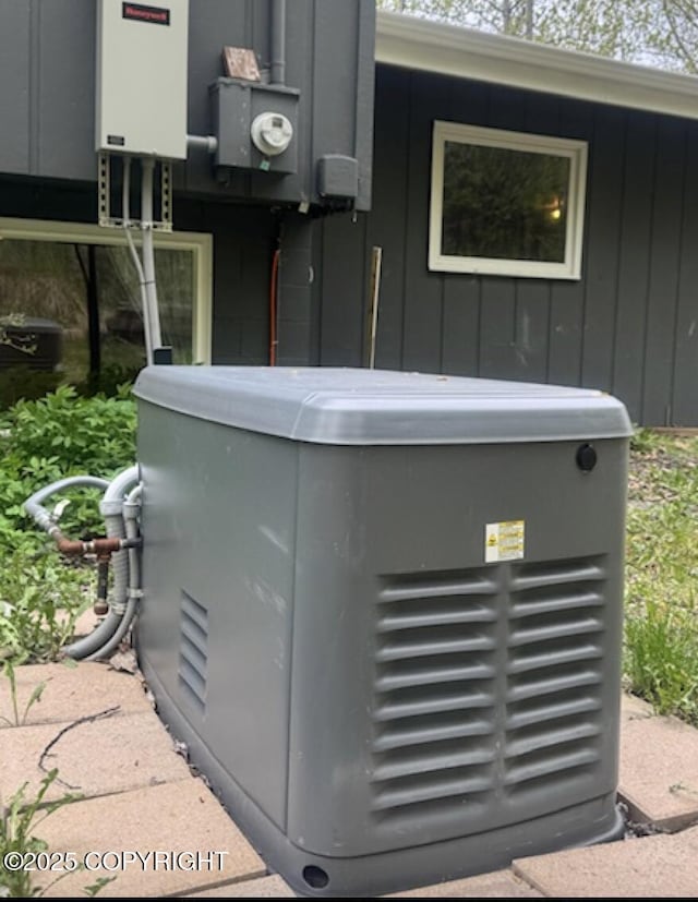 26266 Vallihi Cir, Eagle River, AK 99577 - exterior view of a power unit, board and batten siding, and electric meter