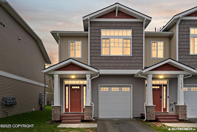 1473 Shallow Pool Dr # J1, Anchorage, AK 99504 - craftsman inspired home featuring a garage, stone siding, and asphalt driveway