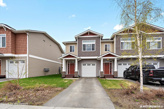 1473 Shallow Pool Dr # J1, Anchorage, AK 99504 - view of front facade with an attached garage, driveway, a front yard, and entry steps