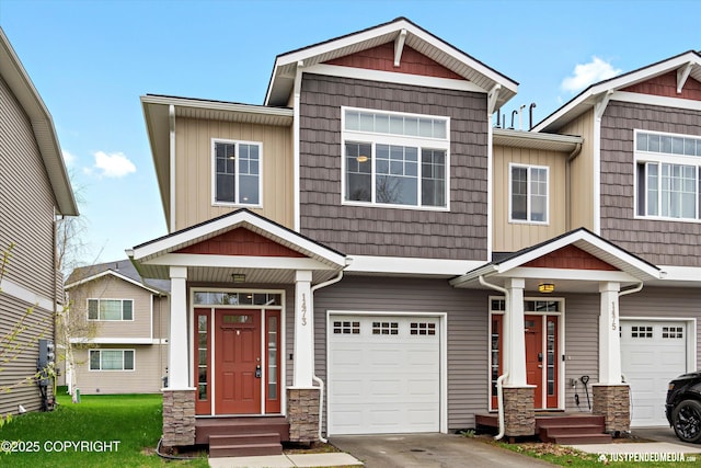 1473 Shallow Pool Dr # J1, Anchorage, AK 99504 - craftsman house with an attached garage, stone siding, and concrete driveway