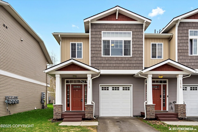 1473 Shallow Pool Dr # J1, Anchorage, AK 99504 - craftsman house with a garage, asphalt driveway, and stone siding