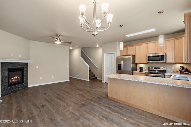 1473 Shallow Pool Dr # J1, Anchorage, AK 99504 - kitchen with appliances with stainless steel finishes, light brown cabinets, ceiling fan, open floor plan, and a peninsula