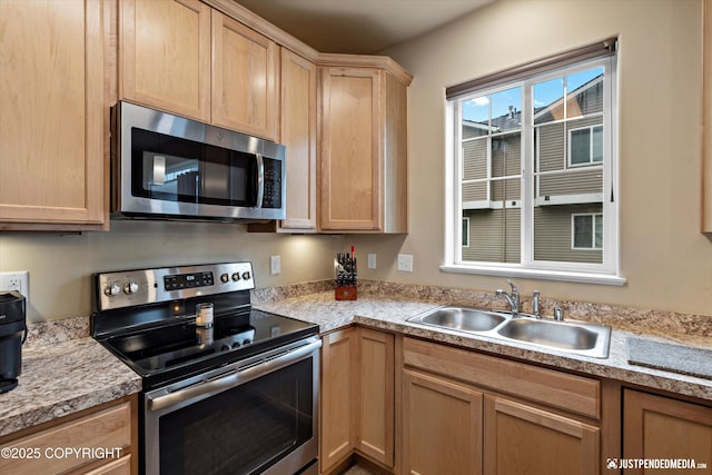 1473 Shallow Pool Dr # J1, Anchorage, AK 99504 - kitchen with stainless steel appliances, a sink, light brown cabinetry, and light countertops