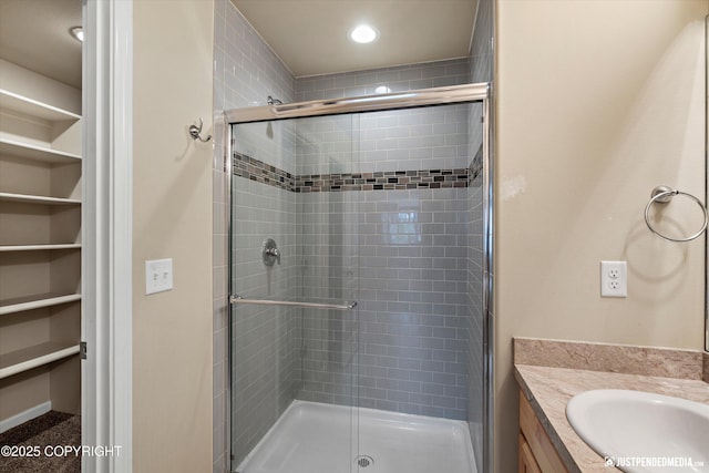 1473 Shallow Pool Dr # J1, Anchorage, AK 99504 - full bath with a stall shower, vanity, a spacious closet, and recessed lighting