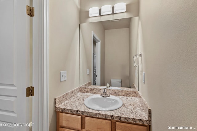 1473 Shallow Pool Dr # J1, Anchorage, AK 99504 - bathroom featuring vanity and toilet