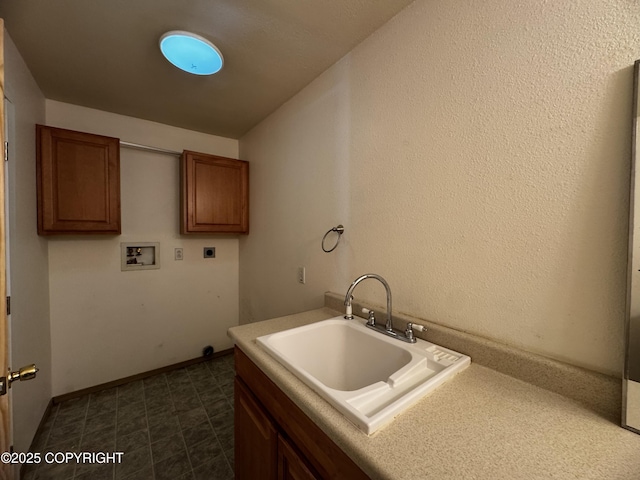 33325 Vinewood Ln, Seward, AK 99664 - laundry room with electric dryer hookup, hookup for a washing machine, cabinet space, baseboards, and dark floors