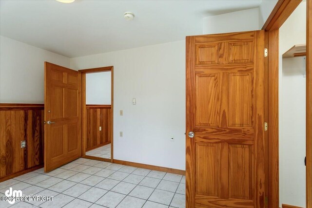14184 W Jojoba Rd, Big Lake, AK 99623 - unfurnished bedroom featuring light tile patterned flooring