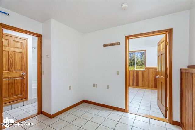 14184 W Jojoba Rd, Big Lake, AK 99623 - unfurnished room featuring light tile patterned flooring, baseboards, and a smoke detector