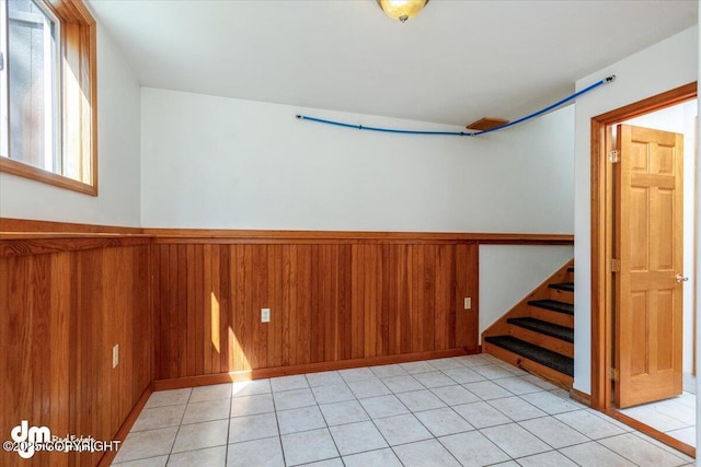 14184 W Jojoba Rd, Big Lake, AK 99623 - empty room with stairs, wainscoting, and wooden walls