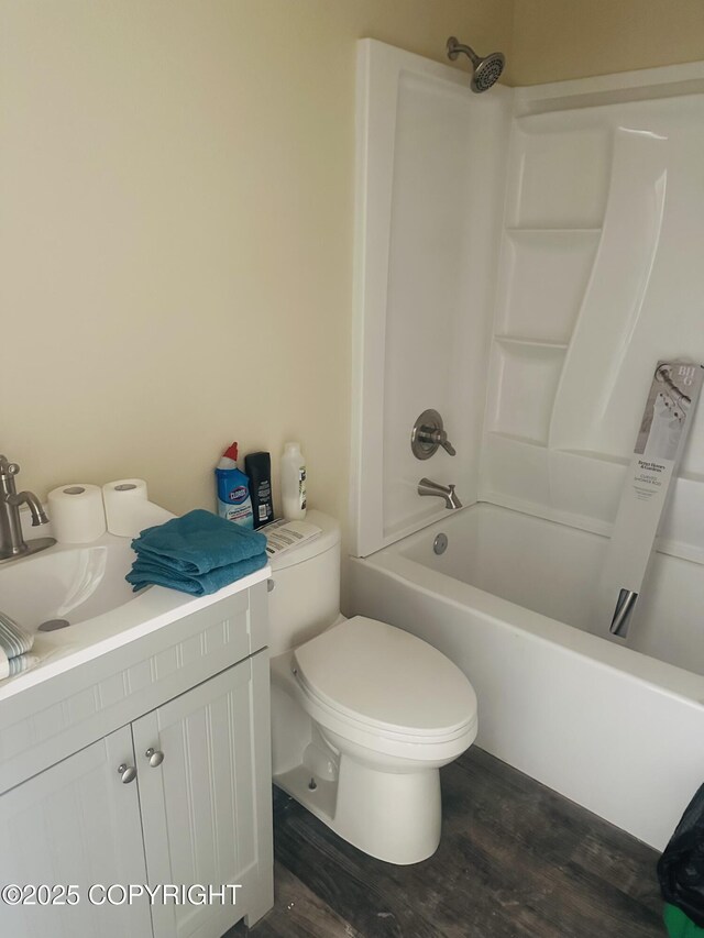 14184 W Jojoba Rd, Big Lake, AK 99623 - bathroom featuring toilet, shower / bath combination, wood finished floors, and vanity