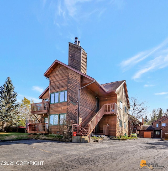 4230 Woronzof Dr # D, Anchorage, AK 99517 - view of building exterior with stairs