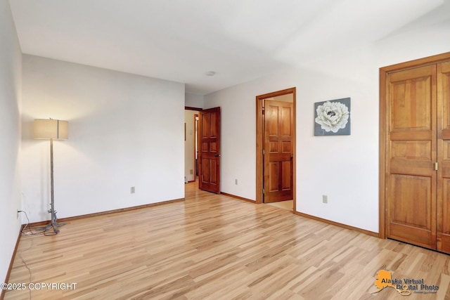 4230 Woronzof Dr # D, Anchorage, AK 99517 - unfurnished bedroom with light wood finished floors and baseboards