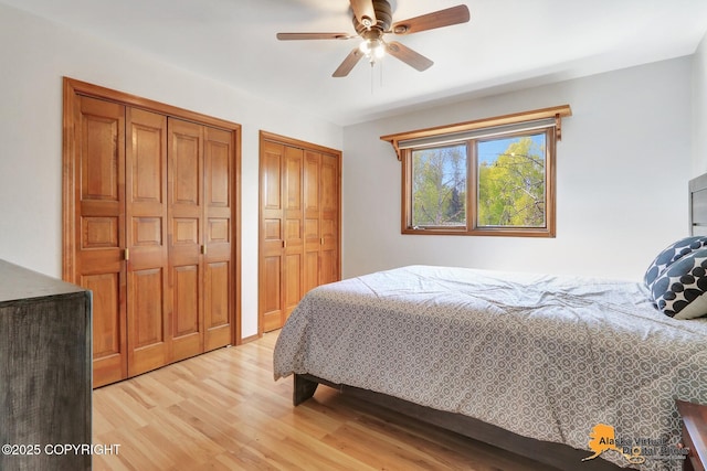 4230 Woronzof Dr # D, Anchorage, AK 99517 - bedroom featuring two closets, light wood-style floors, and ceiling fan