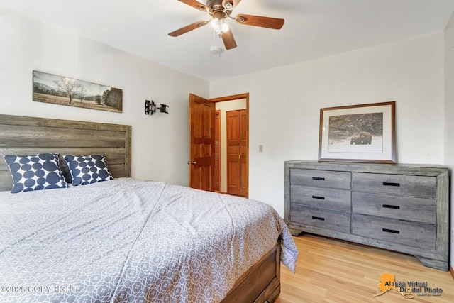4230 Woronzof Dr # D, Anchorage, AK 99517 - bedroom with light wood-style flooring and ceiling fan