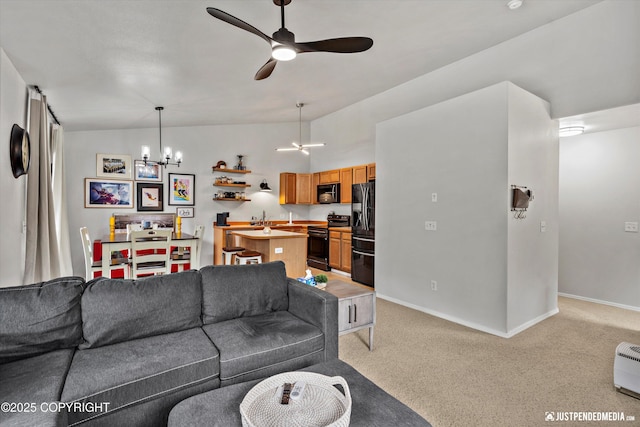 living room with a chandelier, a ceiling fan, light carpet, baseboards, and lofted ceiling