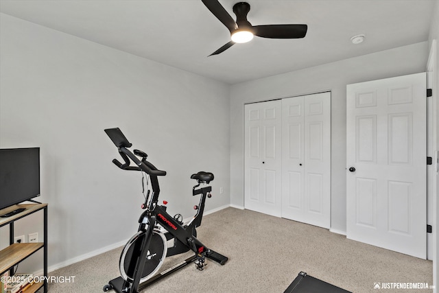 exercise room featuring ceiling fan, carpet floors, and baseboards