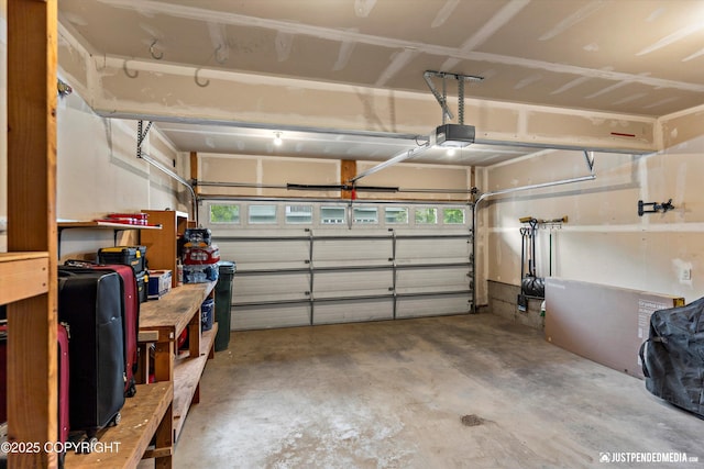 garage featuring a garage door opener