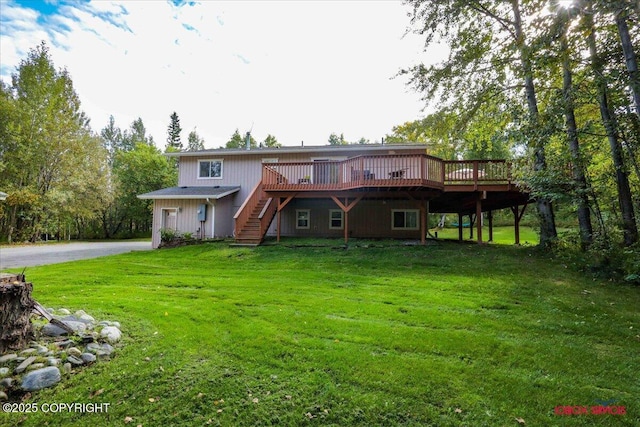 2750 E Whispering Woods Dr, Wasilla, AK 99654 - rear view of property featuring a wooden deck, stairway, and a yard