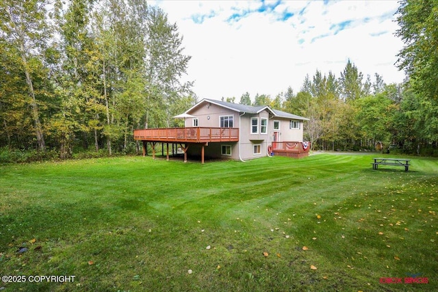 2750 E Whispering Woods Dr, Wasilla, AK 99654 - rear view of property with a wooden deck and a yard