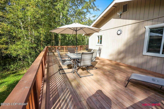 2750 E Whispering Woods Dr, Wasilla, AK 99654 - wooden terrace with outdoor dining space