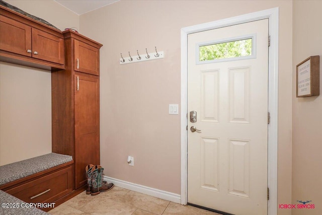 2750 E Whispering Woods Dr, Wasilla, AK 99654 - mudroom featuring baseboards and light tile patterned flooring