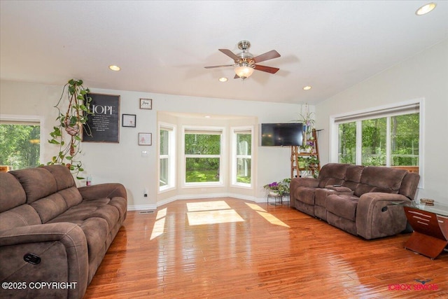 2750 E Whispering Woods Dr, Wasilla, AK 99654 - living area with wood finished floors, a ceiling fan, recessed lighting, baseboards, and vaulted ceiling