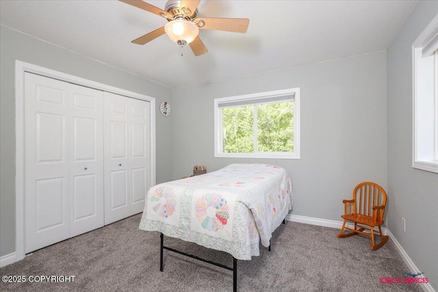 2750 E Whispering Woods Dr, Wasilla, AK 99654 - carpeted bedroom with a closet, a ceiling fan, and baseboards
