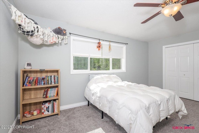 2750 E Whispering Woods Dr, Wasilla, AK 99654 - carpeted bedroom with a closet, baseboards, and ceiling fan
