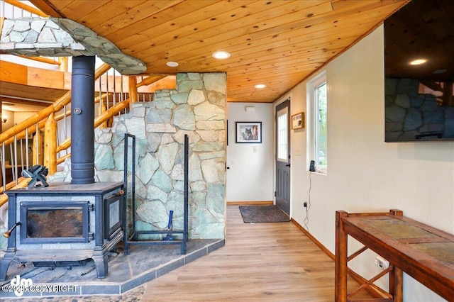 corridor featuring wooden ceiling, wood finished floors, baseboards, and recessed lighting