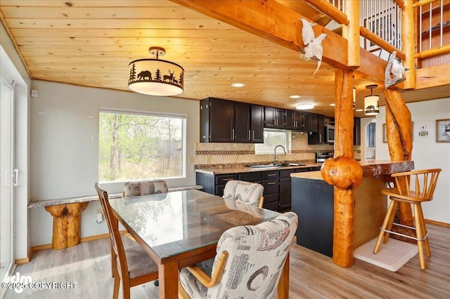 dining room featuring light wood-style floors, wooden ceiling, baseboards, and recessed lighting