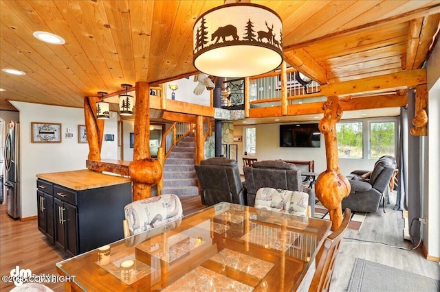 dining area featuring wooden ceiling, light wood-style flooring, recessed lighting, and stairs