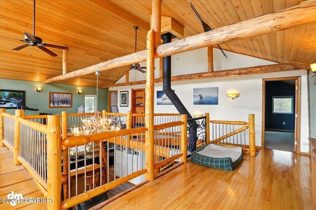 corridor featuring wood ceiling, an upstairs landing, and wood-type flooring