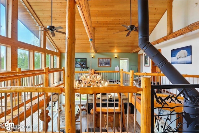 detailed view of ceiling fan, wooden ceiling, and beamed ceiling