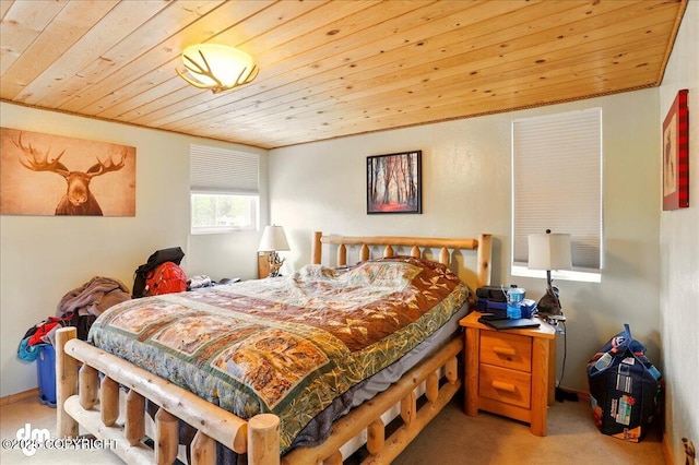 bedroom featuring wooden ceiling and carpet