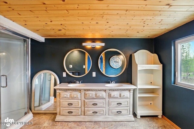 bathroom with wooden ceiling, a stall shower, double vanity, and baseboards