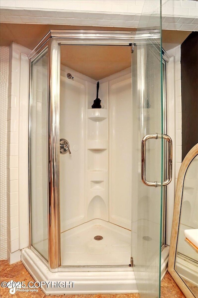 bathroom featuring a stall shower