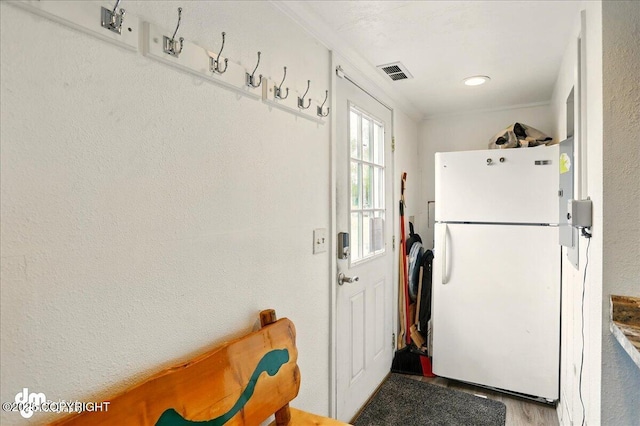 clothes washing area featuring wood finished floors