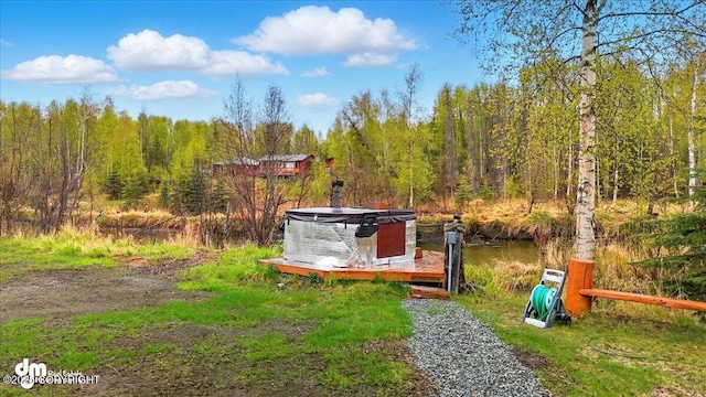view of yard with a forest view