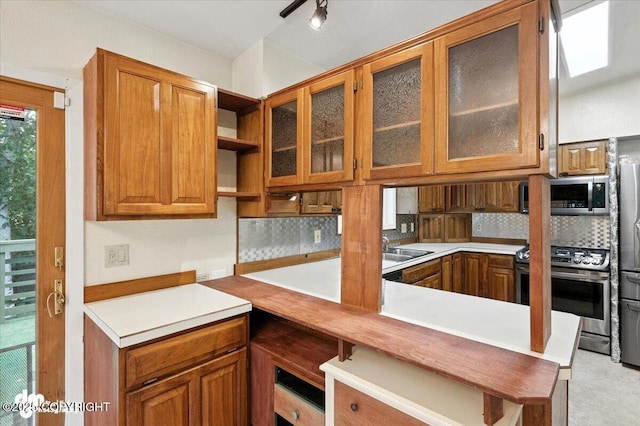 3337 Madison Way, Anchorage, AK 99508 - kitchen with appliances with stainless steel finishes, backsplash, brown cabinets, and light countertops