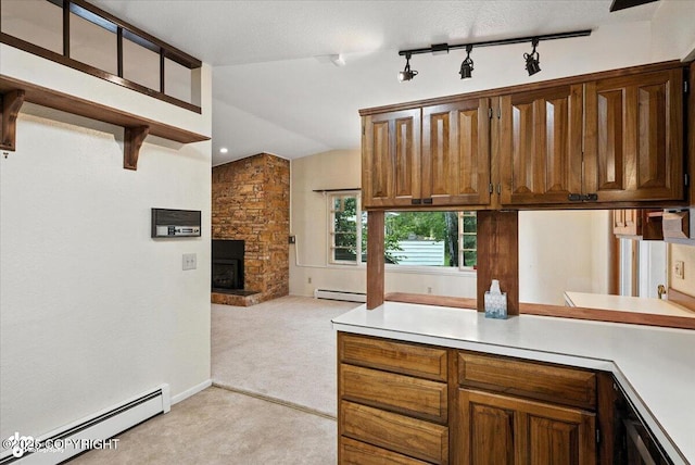 3337 Madison Way, Anchorage, AK 99508 - kitchen with baseboard heating, light colored carpet, light countertops, vaulted ceiling, and a stone fireplace