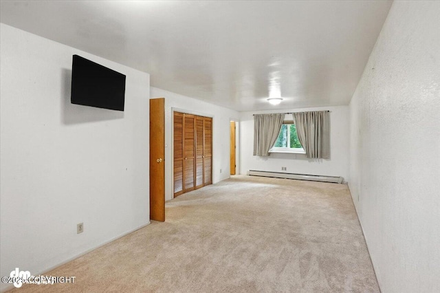 3337 Madison Way, Anchorage, AK 99508 - unfurnished bedroom with a baseboard radiator, carpet floors, and a closet
