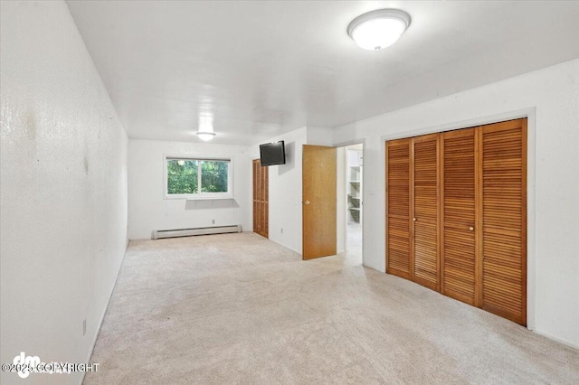 3337 Madison Way, Anchorage, AK 99508 - unfurnished bedroom featuring baseboard heating, carpet, and a closet