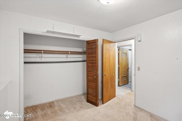 3337 Madison Way, Anchorage, AK 99508 - unfurnished bedroom featuring a closet and carpet floors